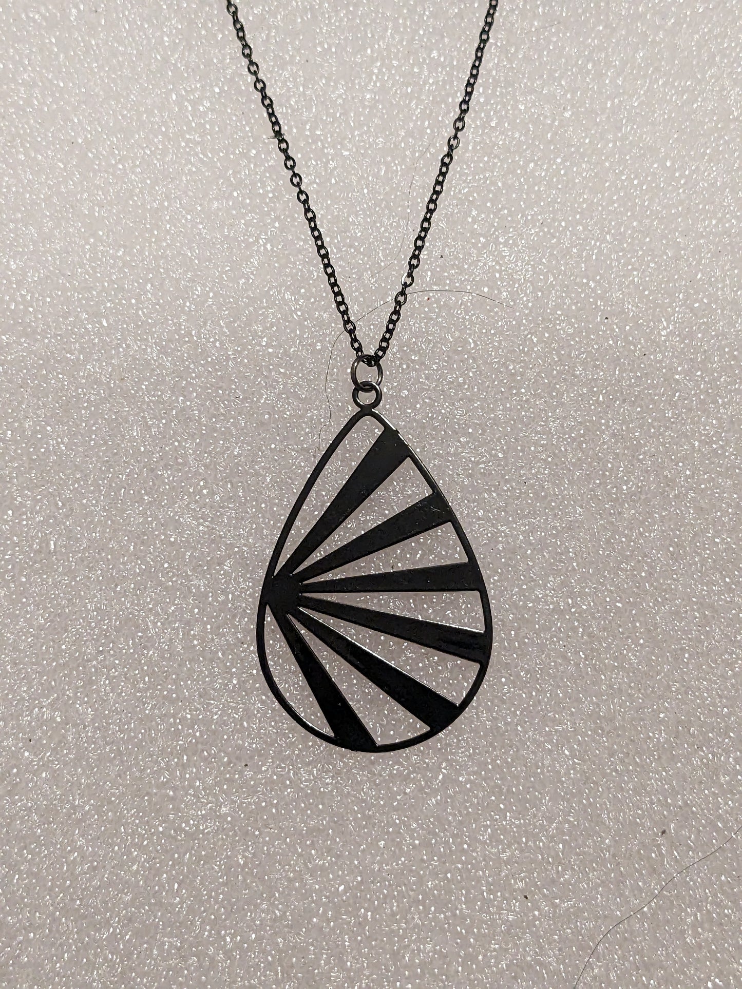 Black sun beam necklace